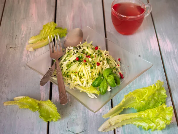 Cabbage salad with cucumbers and berry juice for a light breakfast.