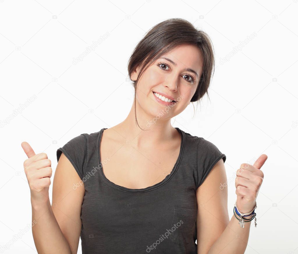 Brunette woman thumbs up isolated on white background
