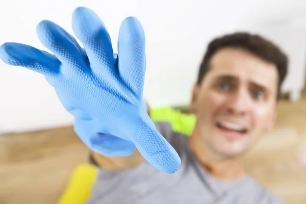 Stressed and screaming young men during cleaning. He has enough housekeeping