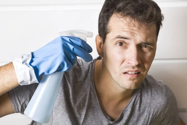 Stressed young men during cleaning. He has enough housekeeping