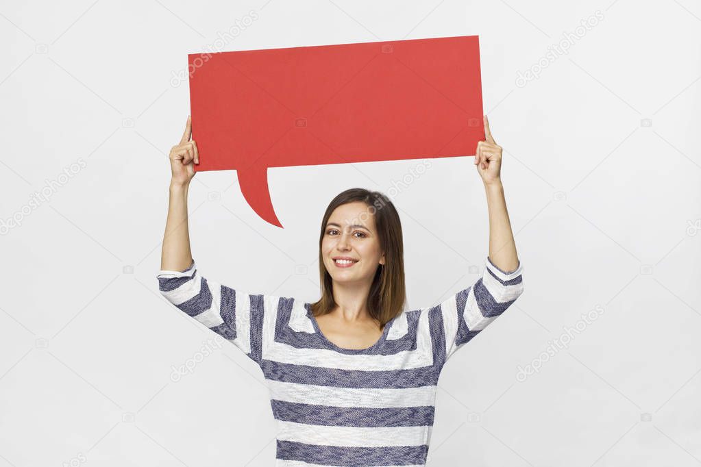 Happy brunette woman in casual clothes with red speech bubble on white background