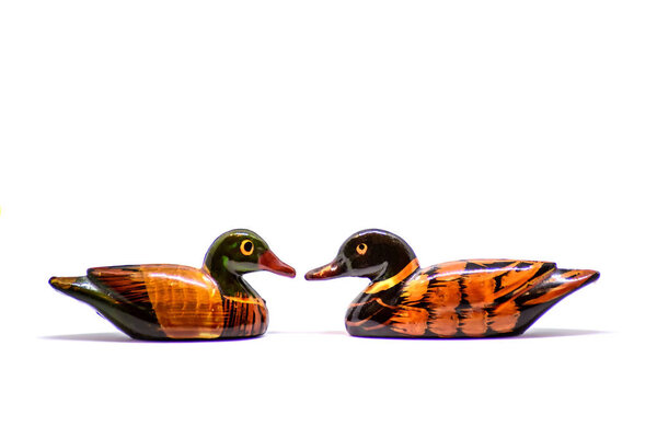 Lacquered wood figurines duck isolate on white background
