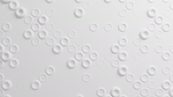 シームレスな 3 d アニメーションで面移動で美しい白の円環。抽象的なモーション デザインの背景。コンピューターには、プロセスが生成されます。4 k Uhd 3840 x 2160. — ストック動画