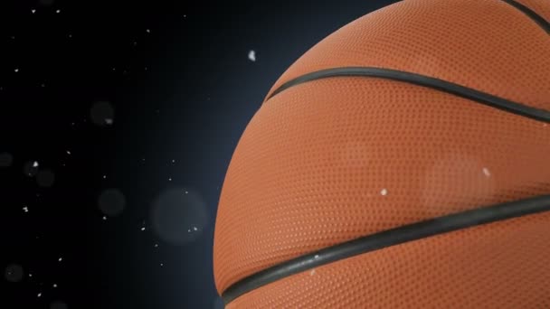 Krásný basketbalový míč rotující detail v pomalém pohybu na černé prachové částice letící. Tvořili basketbalové 3d animace otáčení koule. 4k Uhd 3840 x 2160. — Stock video