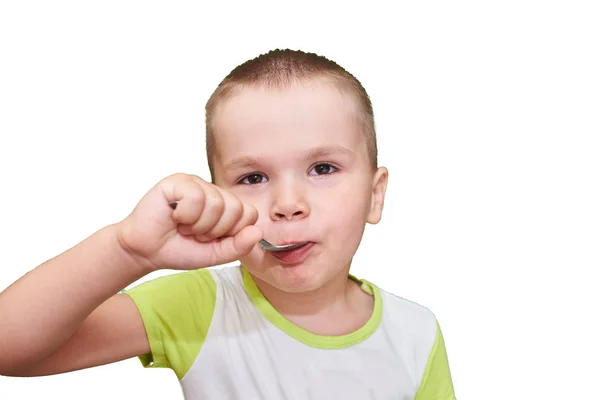 Kleine jongen met lepel in de hand. — Stockfoto