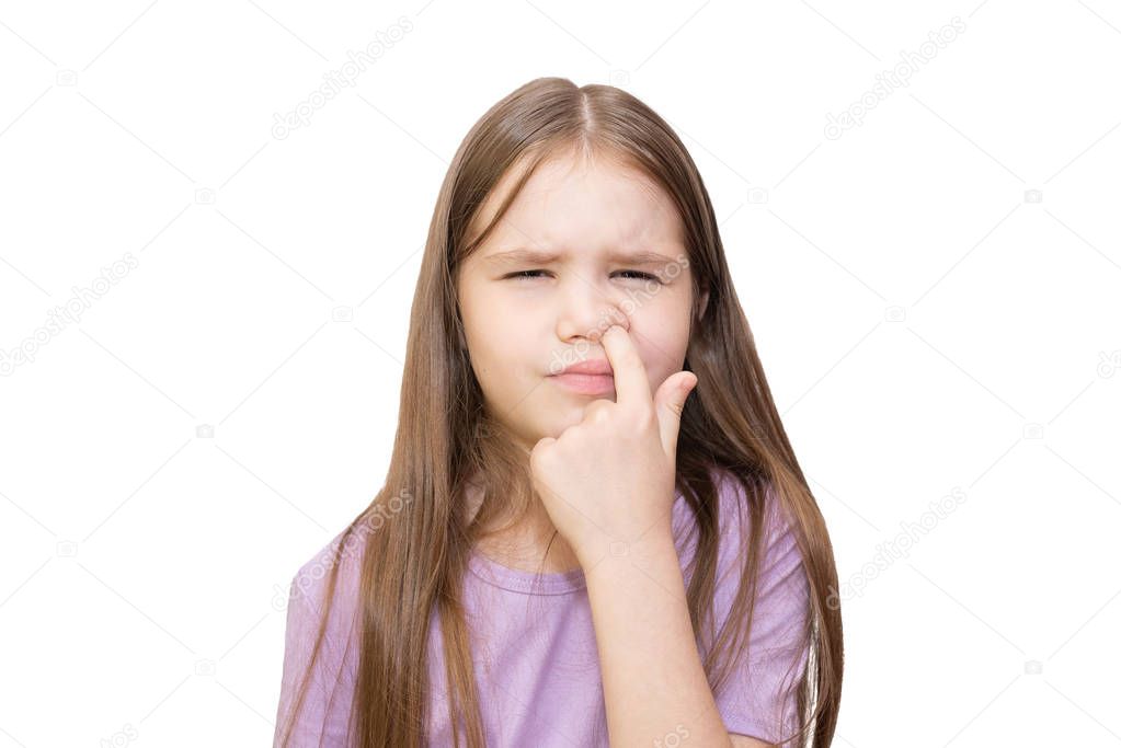 The little girl is strongly picked a nose Is isolated on a white background. 