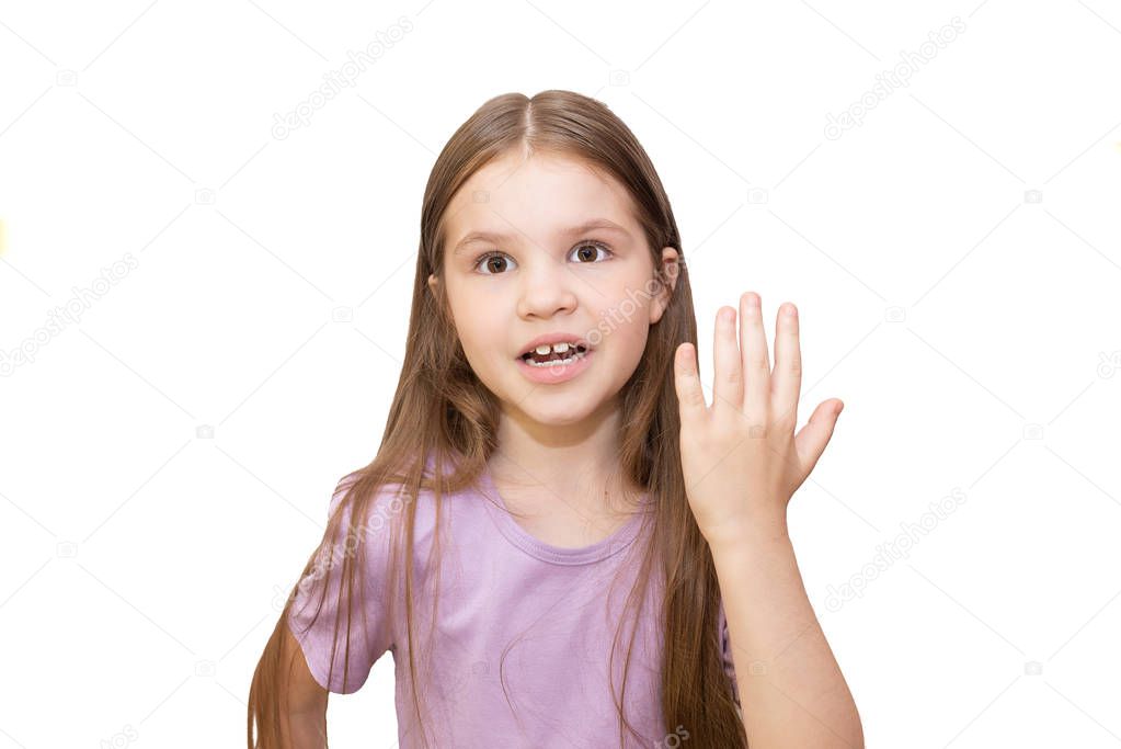 The little girl in surprise and raised her hand in bewilderment. Isolated on a white background.