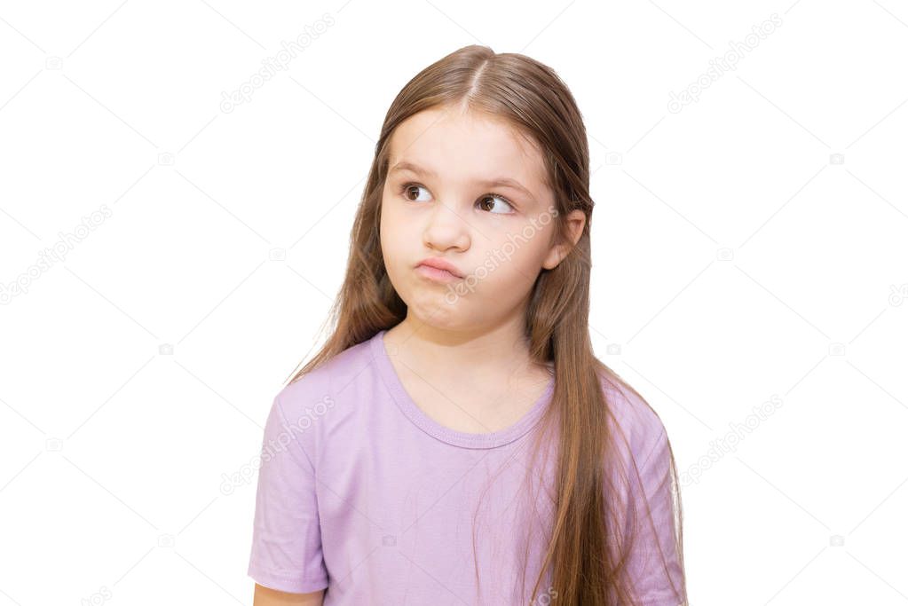 Little girl is skeptical looking up. Isolated on a white background.