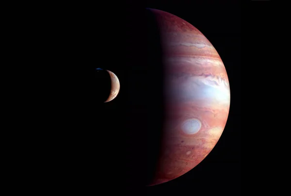 Jupiter cu satelitul Europa, pe un fundal întunecat. Elemente ale acestei imagini au fost furnizate de NASA. — Fotografie, imagine de stoc