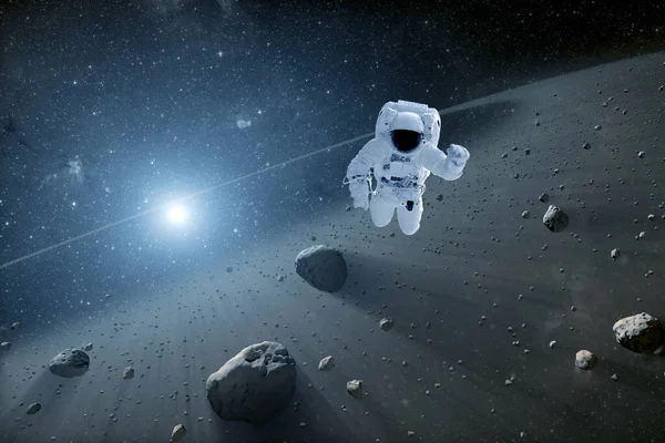 Astronaut in a meteorite field. Elements of this image were furnished by NASA. — Stock Photo, Image