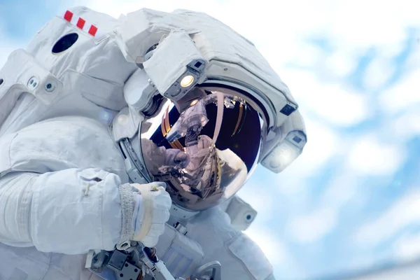 Astronaut in open space above the planet. Elements of this image were furnished by NASA. — Stock Photo, Image