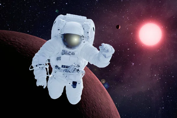 Astronaut in orbit of the red planet. Elements of this image were furnished by NASA. — Stock Photo, Image