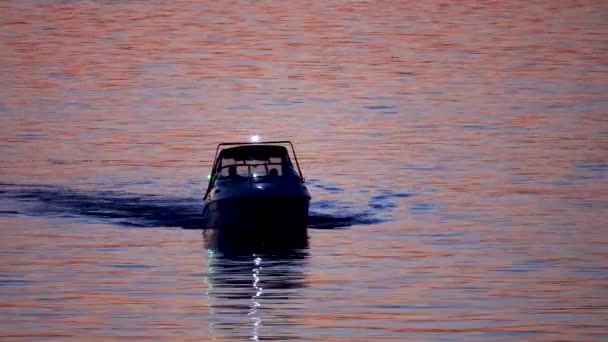 Fishing schooner at sunset, boat silhouette. — Stock Video