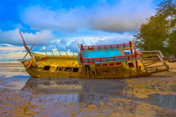 the old ship wreck stuck on the mud near Chalong gulf