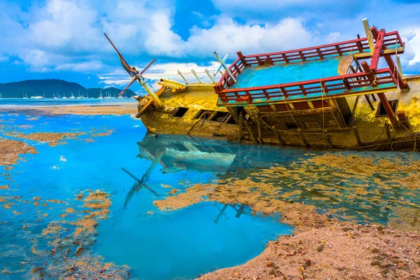 the old ship wreck stuck on the mud near Chalong gulf