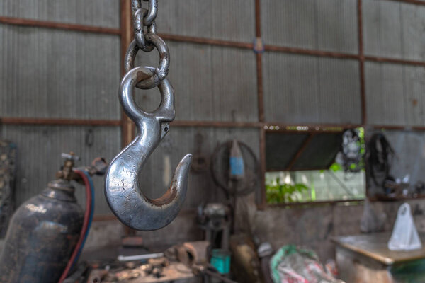 Steel hook for engine lift for easy operation in car repair.