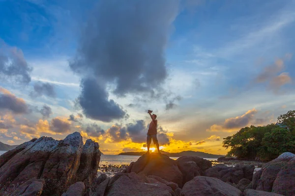 sunrise above the sea one man selfie on the rock