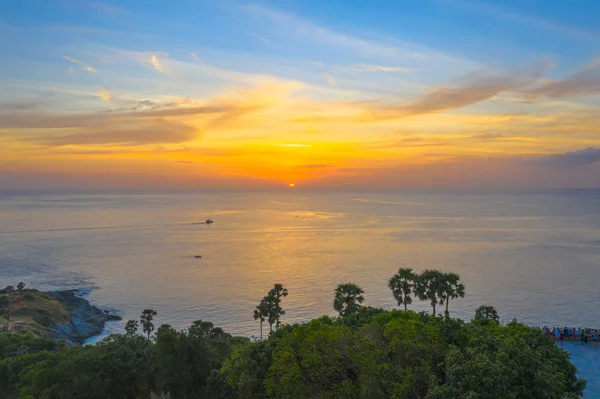 aerial photography sunset above the great lighthouse at Promthep cape Phuket Thailand