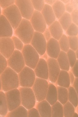 Hafif sarı köpük plastik doku. Soyut strafor arka plan. Makro bakış.