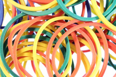 Çok parçalı ileti örneği kauçuklar arka planı renkli. Para için diş etleri. İş ofis ekipmanları kavramı. Makro bakış.