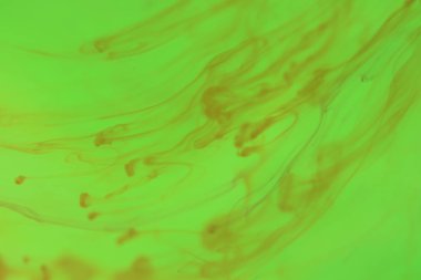 Turuncu mürekkep damla su fırtınada. Mistik damla eğrileri. Arka plan.