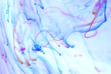 Renkli mürekkep damlaları dalgalar hareket dinamik su. Yumuşak ortam arka plan.