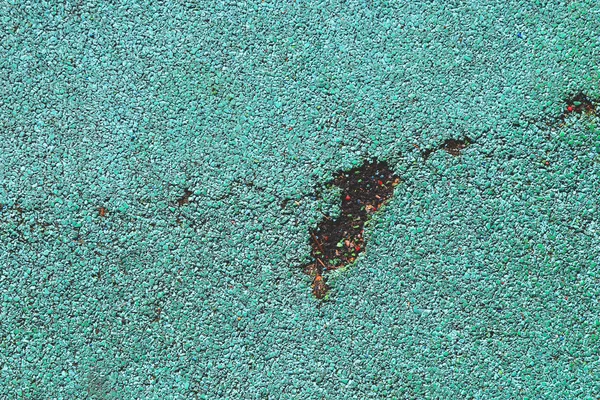 Crack on Rubber floor texture. Playground material background.