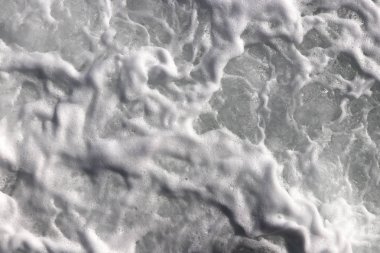 Deniz dalga köpüğü doku. Deniz aqua devinim yüzey arka plan. Açık su köpük zemin swirls.