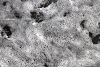 Deniz aqua devinim yüzey arka plan. Deniz dalga köpüğü doku. Açık su köpük zemin swirls.