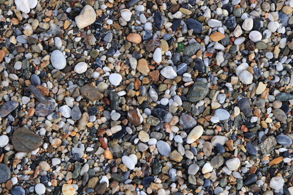 Beach stones surface. Sea pebble texture. Marine mineral beauty harmony.