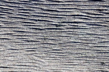 Tire mavi granit duvar doku boyunca çok kesilmiş. Granit yüzey arka plan.