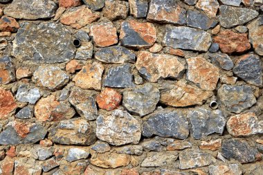 Kaba taş arka plan. Kayalık duvar cobblestones duvar doku kaplama.
