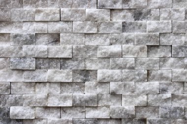 Arka plan beyaz taş yüzey. Kaymak gibi duvar kaplama duvar doku döşer.