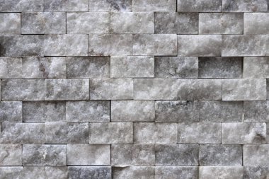 Arka plan beyaz taş yüzey. Kaymak gibi duvar duvar doku döşer.