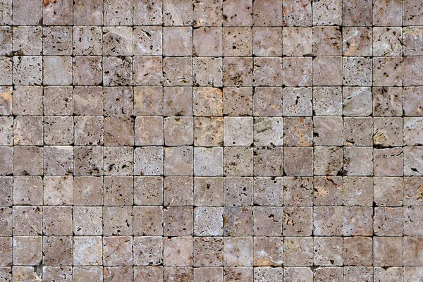 Travertine masonry tiles cladding wall texture. Square stones surface background.