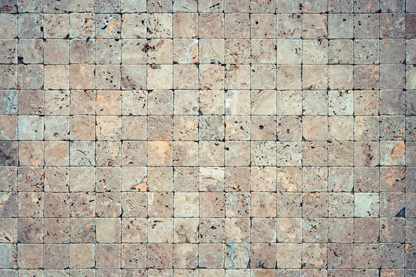 Square stones surface background. Travertine masonry tiles cladd