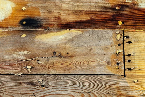 Wooden ship board with nails and screws background. Wood planks