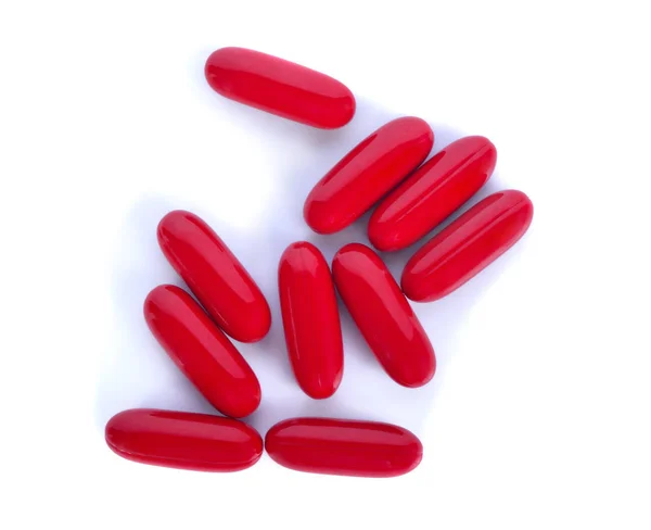 Pilha Comprimidos Vermelhos Isolados Fundo Branco Vista Superior — Fotografia de Stock