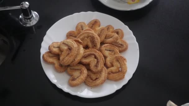 Cookies in white plate — Stock Video