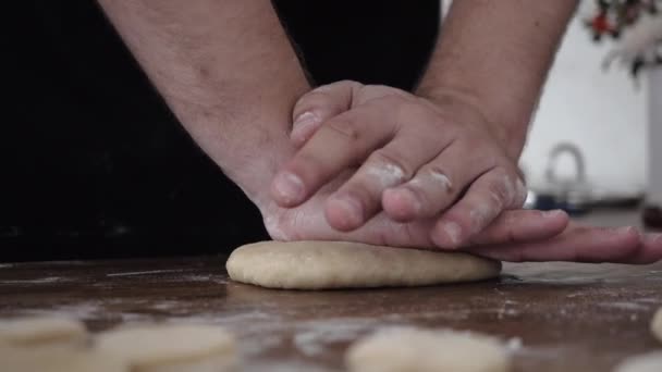 Cook kneads the dough with his hands — Stock Video