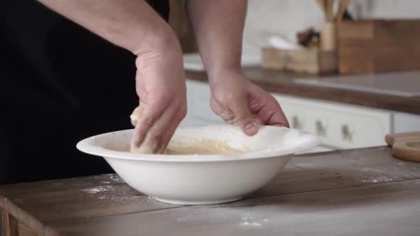 Cook kneads the dough with his hands — Stock Video
