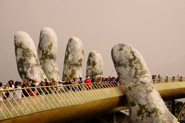 The Golden Bridge is a 150-metre-long pedestrian bridge in the Ba Na Hills resort, near Da Nang, Vietnam.                      