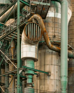 Industrial tower rusty pipes grunge texture poster structure. Massive metal cylinder with corroded vents, oxidized pipes and weathered steel, perfect as industrial wallpaper or texture