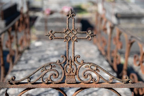 Old religious cross in a Catholic cemetery