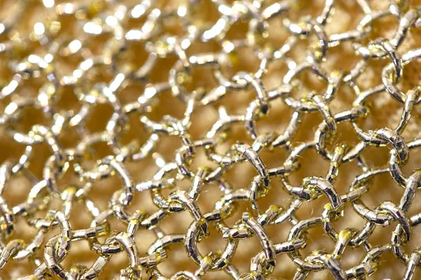 Close Up Of Gold Fabric Chain mail Sewing