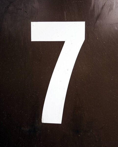 Written Wording in Distressed State Typography Found Number Seven 7 