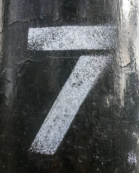 Written Wording in Distressed State Typography Found Number Seven 7 