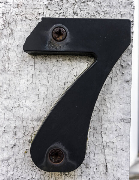 Written Wording in Distressed State Typography Found Number Seven 7 