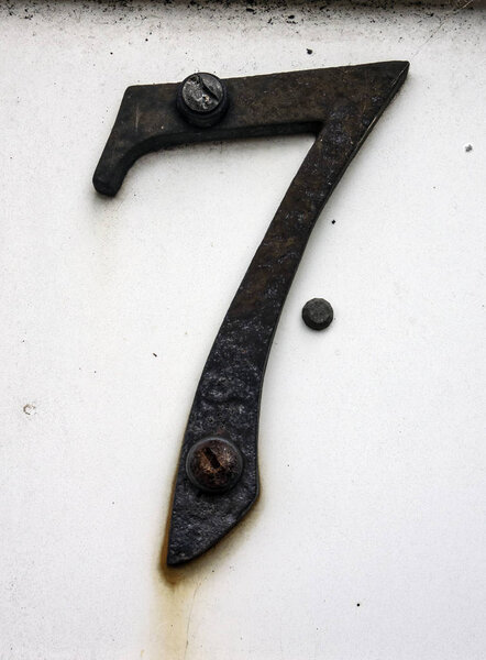 Written Wording in Distressed State Typography Found Number Seven 7 