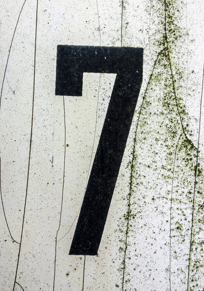Written Wording in Distressed State Typography Found Number Seven 7 